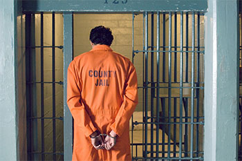 Prisoner entering his cell.