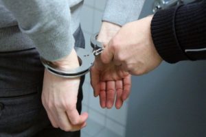 A man in Rhode Island handcuffed for gun possession.
